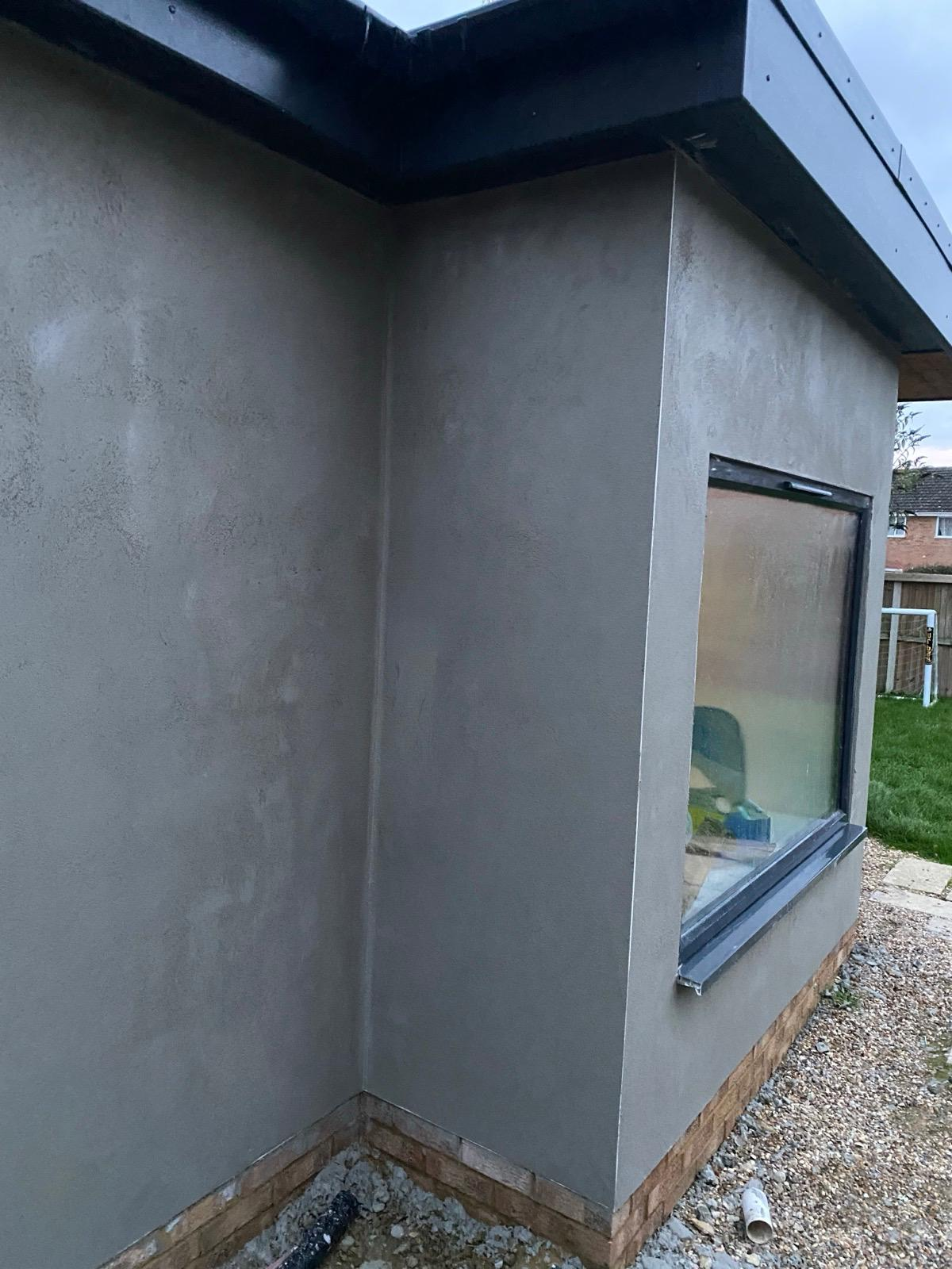 Rendered extension corner with a large window