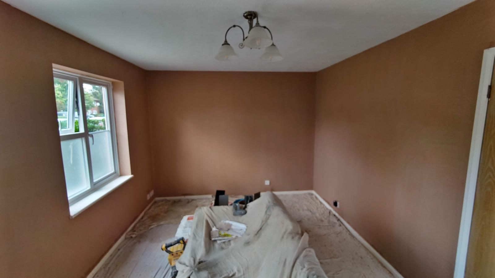 Fresh plaster drying smoothly across three interior walls