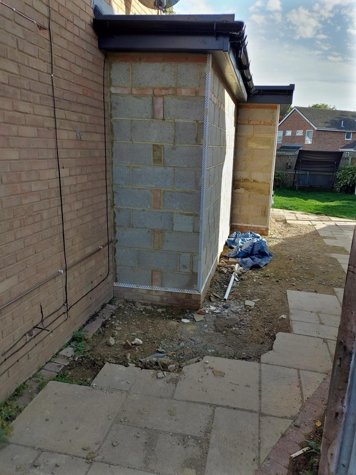 Blockwork extension walls fitted with corner and base render beads