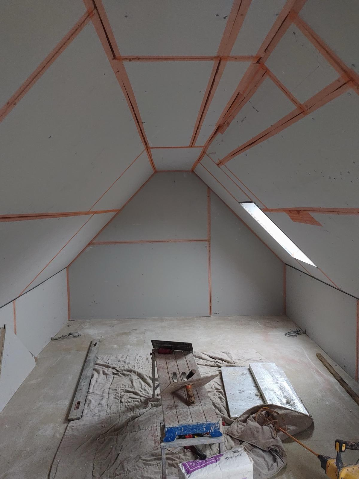 Plasterboarded loft with scrim tape on joints, ready for plastering